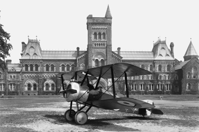 A Sopwith Camel aircraft rests on the Front Campus lawn in 1918, during World War I.