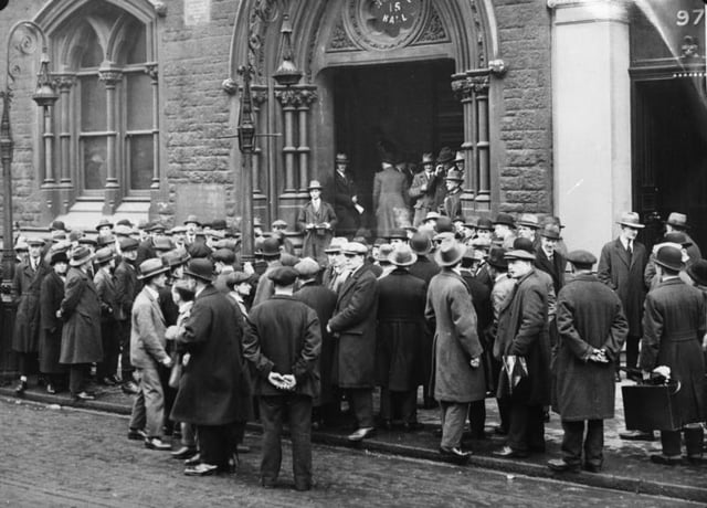 Unemployed people in front of a workhouse in London, 1930