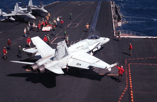 A Marine F/A-18 from VMFA-451 prepares to launch from USS Coral Sea (CV-43)