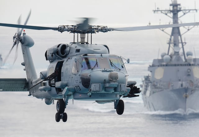 A MH-60R prepares to land aboard USS John C. Stennis