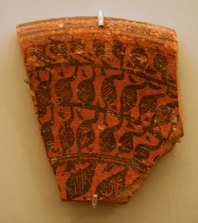 Fragment of a large deep vessel; circa 2500 BC; red pottery with red and black slip-painted decoration; 12.5 × 15.5 cm (4​15⁄16 × 6​1⁄8 in.); Brooklyn Museum (New York City).