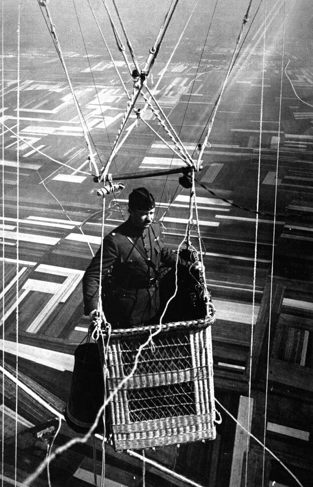 An American major, piloting an observation balloon near the front, 1918