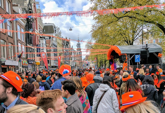 Dutch people in orange celebrating King's Day in Amsterdam, 2017