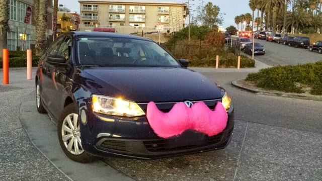 A Lyft vehicle in Santa Monica, California, with the original grill-stache branding, since retired