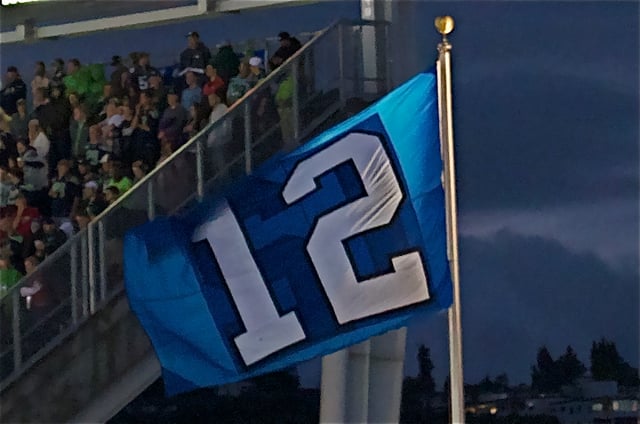 A giant #12 flag of the Seattle Seahawks.