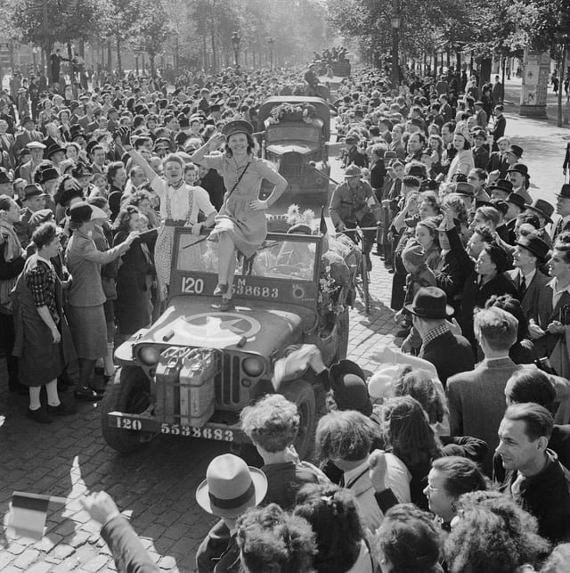 Cheering crowds greet British troops entering Brussels, 4 September 1944