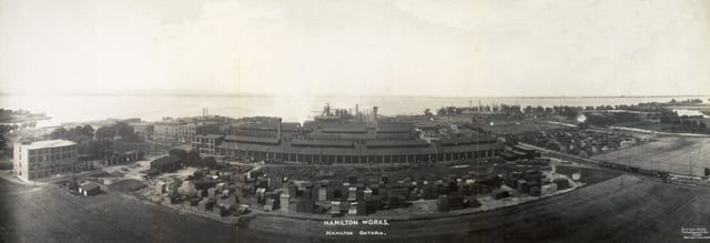 International Harvester Company buildings by the waterfront, taken in 1907. The rise of industry in the city led to economic and population growth until the 1960s.