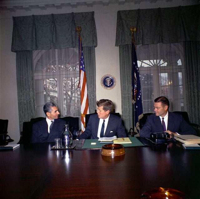 Mohammad Reza Pahlavi (the Shah of Iran), Kennedy, and U.S. Defense Secretary Robert McNamara in the White House Cabinet Room on April 13, 1962