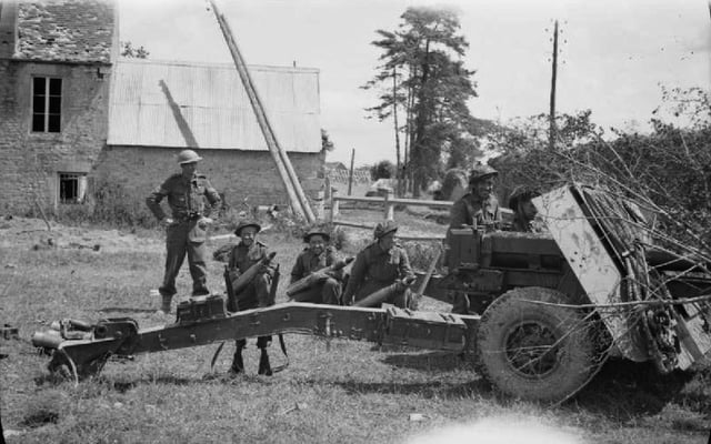 17-pounder gun, three loaders standing by with AP ammunition during Operation Epsom, 27 June 1944.