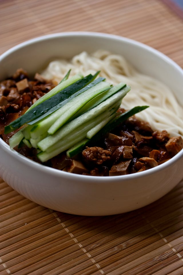 Zhájiàng Miàn (noodles with bean paste) is a traditional northern Chinese dish. It has been spread to South Korea and known as Jajangmyeon.