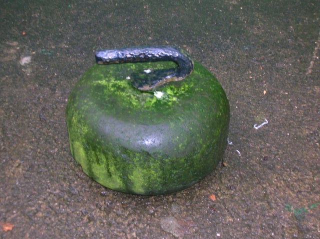 An old-style curling stone