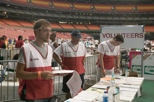Volunteers assist Hurricane victims at the Houston Astrodome, following Hurricane Katrina.