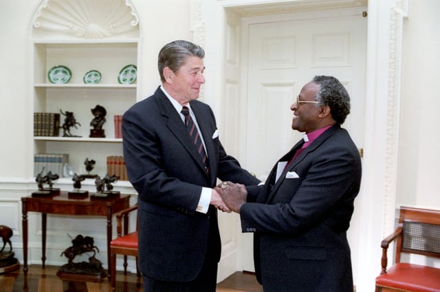U.S. President Ronald Reagan meeting with Desmond Tutu in 1984. Tutu described Reagan's administration as "an unmitigated disaster for us blacks", and Reagan himself as "a racist pure and simple"