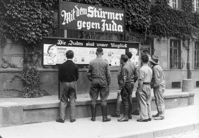Public reading of the antisemitic newspaper Der Stürmer, Worms, Germany, 1935