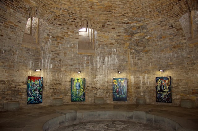 The crypt at Wewelsburg was repurposed by Himmler as a place to memorialize dead SS members. Artwork commemorating the Holocaust hangs on the walls.