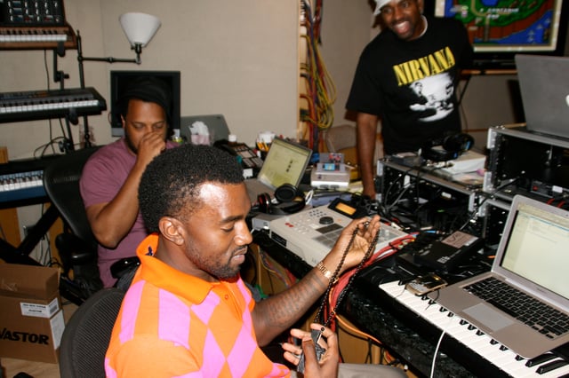 West (center) working on the album with his former mentor, producer No I.D. (left).