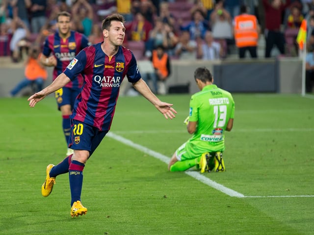 Messi celebrating his second goal against Granada in September 2014