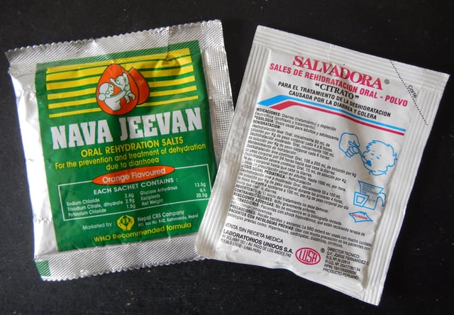 Examples of commercially available oral rehydration salts (Nepal on left, Peru on right).