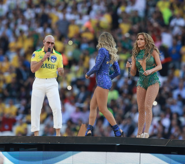 Pitbull (left) with Jennifer Lopez and Claudia Leitte performing at the 2014 FIFA World Cup opening ceremony.