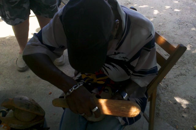 Jamaican-born roadside woodcarver working outside Bodden Town