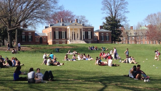 Students socializing on The Beach, with Homewood House in the background