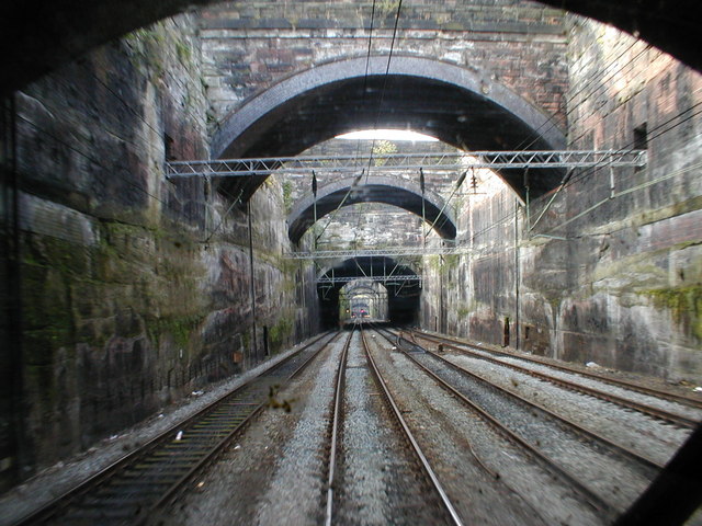 Liverpool Lime Street Approach. The original two track tunnel was removed to create a deep cutting. Some of the road bridges seen across the cutting are solid rock and in effect are a series of short tunnels.