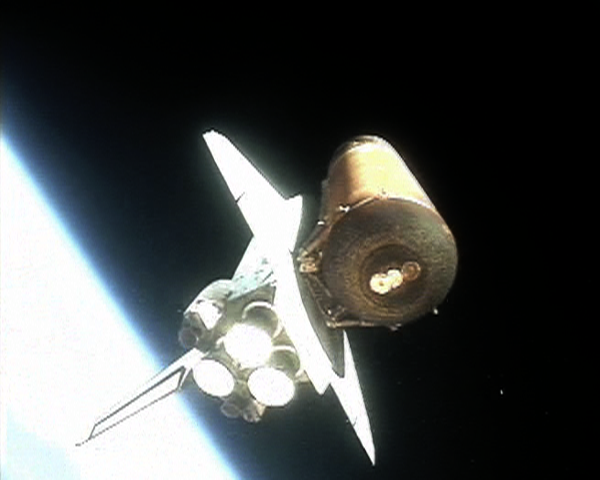Discovery attached to the external tank immediately after solid rocket booster (SRB) separation