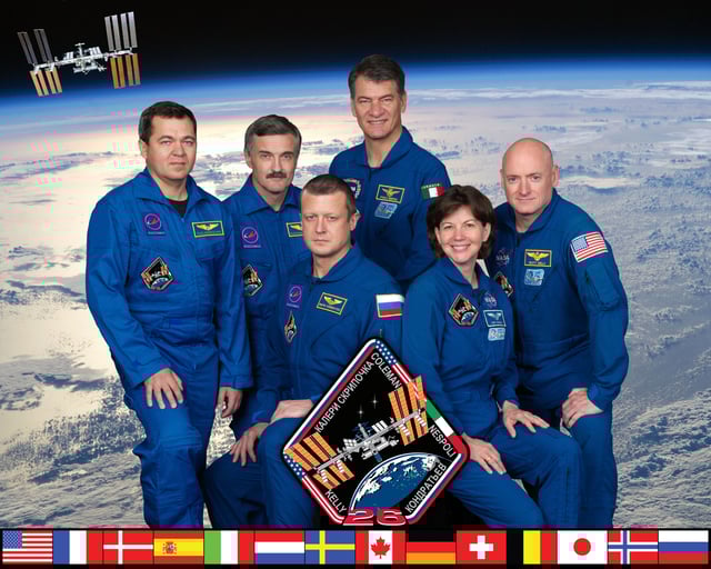 Kelly posing for the Expedition 26 crew picture on July 16, 2010