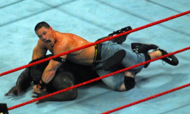 John Cena performs his STF submission hold against Mark Henry