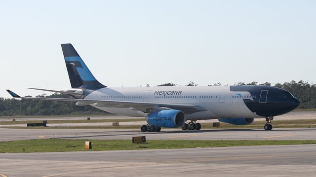 A Mexicana Airbus A330-200 in new livery taxiing at Cancún International Airport, Mexico.
