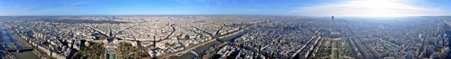 Panorama of Paris as seen from the Eiffel Tower as full 360-degree view (river flowing from north-east to south-west, right to left)