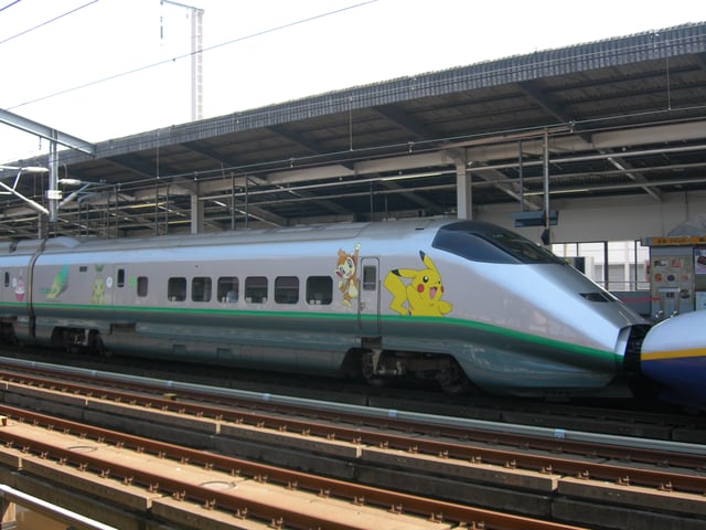 Shinkansen E3 Series train in Pokémon livery.