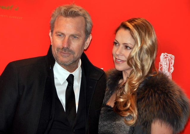 Costner in 2013 with Christine Baumgartner