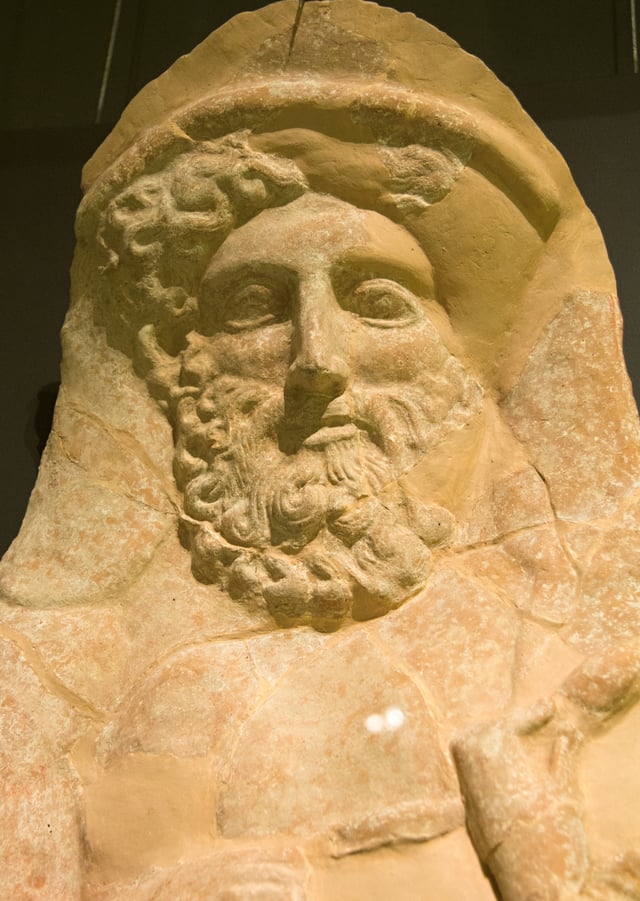 Wall protome of a bearded Dionysus.