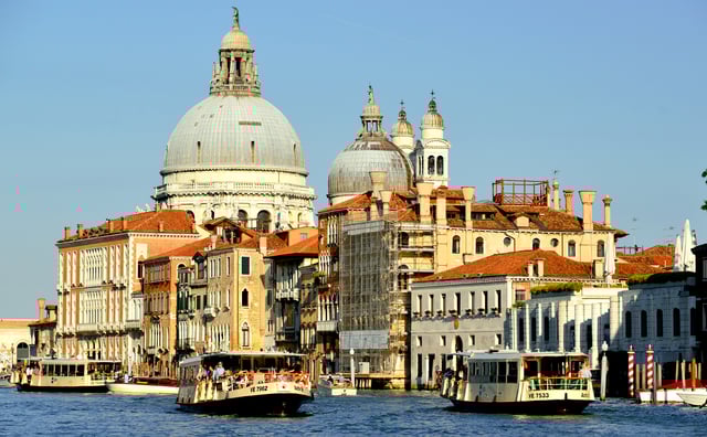 Vaporetti (water buses) carry passengers through the Grand Canal