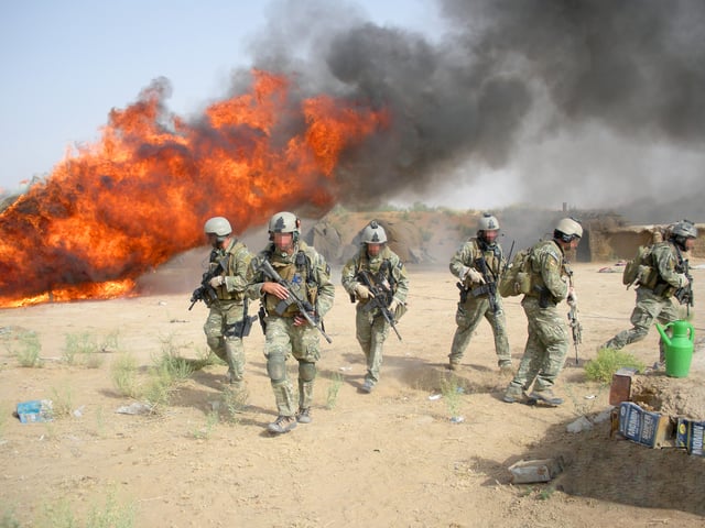 DEA agents in MultiCam uniform burning hashish seized in Operation Albatross in Afghanistan, 2007.