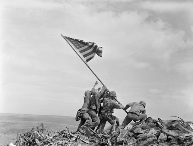 Raising the Flag on Iwo Jima, an iconic photograph taken by Joe Rosenthal on February 23, 1945, depicts six United States Marines raising a U.S. flag atop Mount Suribachi.