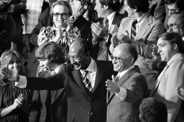Egyptian President Anwar Sadat and Israeli Prime Minister Menachem Begin acknowledge applause during a joint session of Congress in Washington, D.C., during which President Jimmy Carter announced the results of the Camp David Accords, September 18, 1978.