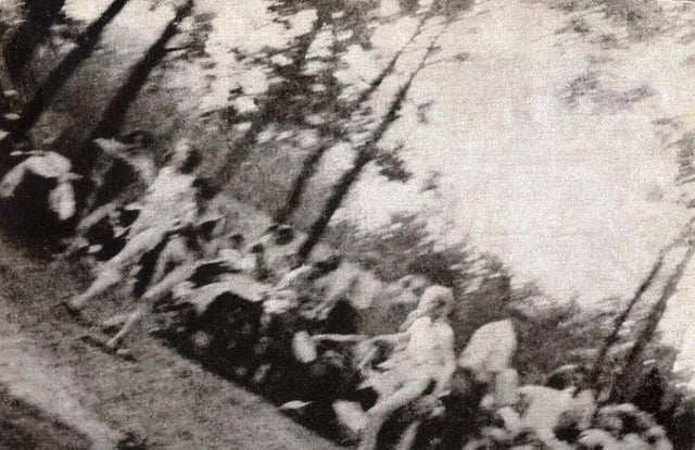 Women on their way to the gas chamber, near Crematorium V, Auschwitz II, August 1944. The Polish resistance reportedly smuggled the film, known as the Sonderkommando photographs, out of the camp in a toothpaste tube.