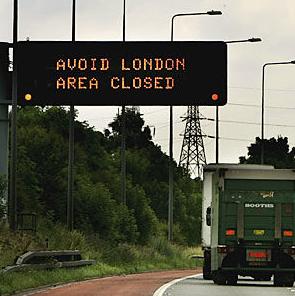 A sign on the M25 London orbital road warns drivers to avoid the city.