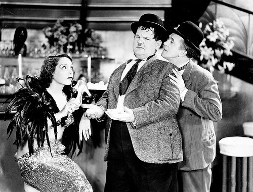 Vélez with Laurel and Hardy in Hollywood Party (1934).