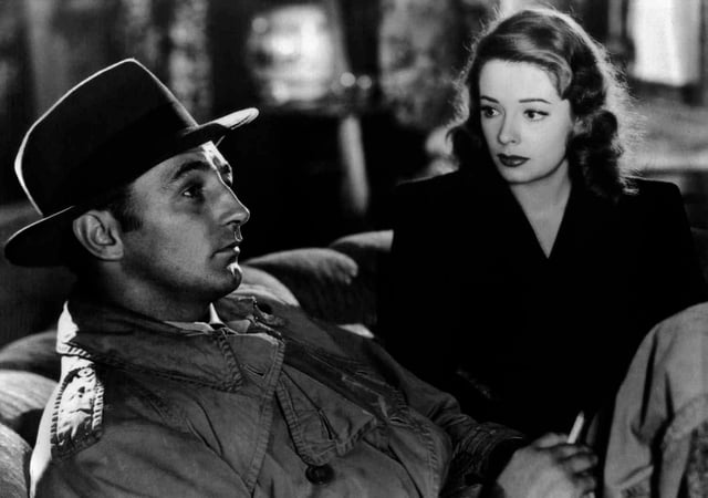 Out of the Past (1947) features many of the genre's hallmarks: a cynical private detective as the protagonist, a femme fatale, multiple flashbacks with voiceover narration, dramatically shadowed photography, and a fatalistic mood leavened with provocative banter. The film stars noir icons Robert Mitchum and Jane Greer.