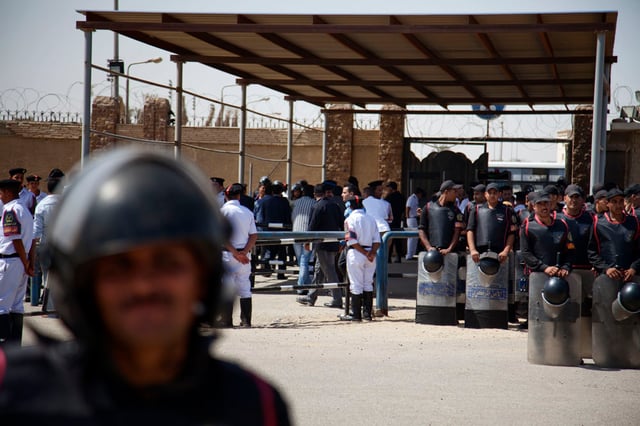Riot police outside the courthouse where Mubarak was being sentenced on 2 June 2012