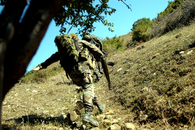 Soldiers of the 13th "Shavnabada" Light Infantry Battalion of the Georgian Army charging up a hill where Ossetian rebels were entrenched.