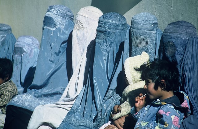 Women in Afghanistan wearing burqas. Some clothes that women are required to wear, by law or custom, can restrict their movements