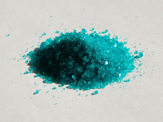 Crystals of hydrated nickel sulfate.