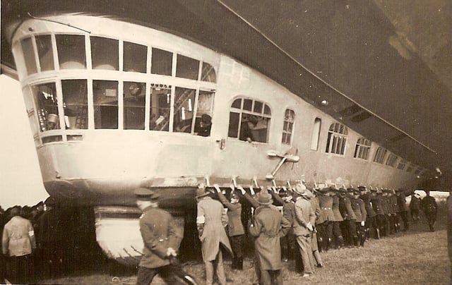 Many people were needed to hold down the D-LZ127. The ram air turbine electric generator is just under the radio room window.