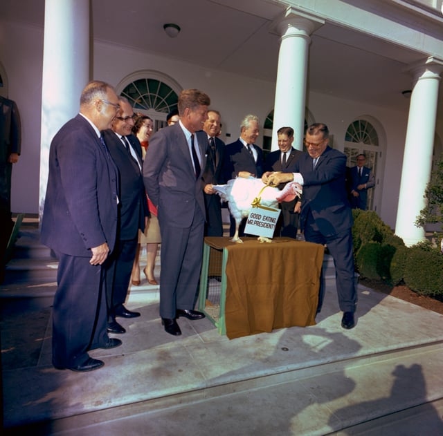 John F. Kennedy unofficially spares a turkey on November 19, 1963 (Kennedy was assassinated three days later). The practice of "pardoning" turkeys in this manner became a permanent tradition in 1989.