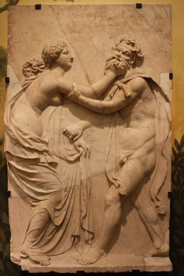 Ancient relief carving from the Naples National Archaeological Museum depicting a fight between satyr and a nymph, a theme which became popular during the Hellenistic Era