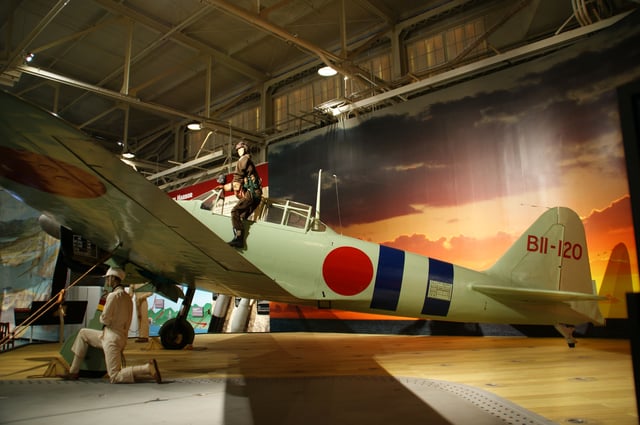 All Zeros involved in the attack on Pearl Harbor were light-colored (IJN gray green) early series A6M2 Model 21s. The painting shows here belongs to the Zeroes on board Japanese aircraft carrier Hiryū.